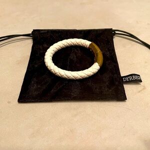 White Italian leather bracelet with gold plated clasp.